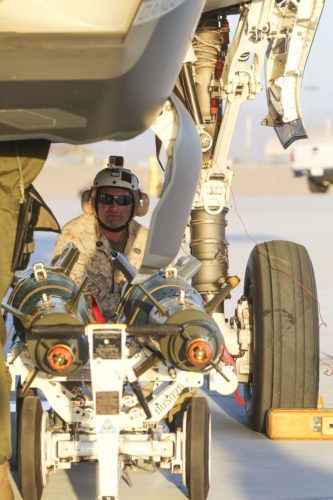 U.S. Marine Corps MSgt. Jason L. Daniel, aviation ordnance chief with Marine Aviation Weapons and Tactics Squadron One (MAWTS-1) supervises the first ever hot load on the F-35B Lightning II in support of Weapons and Tactics Instructor Course (WTI) 1-17 at Marine Corps Air Station Yuma, Ariz., Sept. 22, 2016. The exercise is part of WTI 1-17, a seven-week training event hosted by Marine Aviation Weapons and Tactics Squadron One (MAWTS-1) cadre. MAWTS-1 provides standardized tactical training and certification of unit instructor qualifications to support Marine Aviation Training and Readiness and assists in developing and employing aviation weapons and tactics. (U.S. Marine Corps photograph by SSgt. Artur Shvartsberg, MAWTS-1 COMCAM)