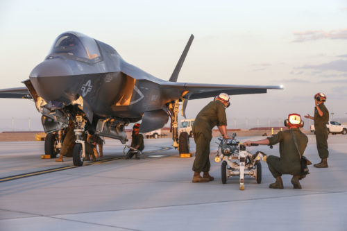 U.S. Marines with Marine Fighter Attack Squadron 121 (VMFA-121), 3rd Marine Aircraft Wing, conduct the first ever hot load on the F-35B Lightning II in support of Weapons and Tactics Instructor Course (WTI) 1-17 at Marine Corps Air Station Yuma, Ariz., Sept. 22, 2016. The exercise is part of WTI 1-17, a seven-week training event hosted by Marine Aviation Weapons and Tactics Squadron One (MAWTS-1) cadre. MAWTS-1 provides standardized tactical training and certification of unit instructor qualifications to support Marine Aviation Training and Readiness and assists in developing and employing aviation weapons and tactics. (U.S. Marine Corps photograph by SSgt. Artur Shvartsberg, MAWTS-1 COMCAM)
