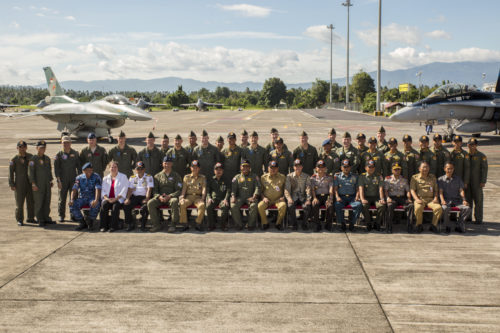 U.S. Marines with Marine All-Weather Fighter Attack Squadron (VMFA (AW)) 225, the Indonesian Air Force and representatives from the U.S. Embassy pose for a photo after an opening ceremony to mark the beginning of exercise Cope West 17 at Sam Ratulangi International Airport, Indonesia, Nov. 1, 2016. This fighter-focused, bilateral exercise between the U.S. Marine Corps and Indonesian Air Force is designed to enhance the readiness of combined interoperability between the two nations. (U.S. Marine Corps photo by Cpl. Aaron Henson)