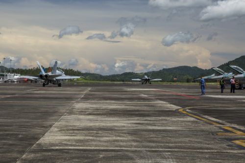 Two U.S. Marine Corps F/A-18D Hornets with Marine All-Weather Fighter Attack Squadron (VMFA (AW)) 225, taxi down the flight line to begin exercise Cope West 17 at Sam Ratulangi International Airport, Indonesia, Nov. 1, 2016. This fighter-focused, bilateral exercise between the U.S. Marine Corps and Indonesian Air Force is designed to enhance the readiness of combined interoperability between the two nations. The squadron plans to complete their unit air-to-air training requirements, which focuses on basic fighter maneuvering, section engaged maneuvering, offensive anti-air warfare and active air defense versus the Indonesian Air Force to increase situational readiness, interoperability, knowledge and partnership between the U.S. and Indonesia. (U.S. Marine Corps photo by Cpl. Aaron Henson)