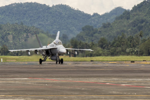 A U.S. Marine Corps F/A-18D Hornet with Marine All-Weather Fighter Attack Squadron (VMFA (AW)) 225, taxis down the flight line during exercise Cope West 17 at Sam Ratulangi International Airport, Indonesia, Nov. 1, 2016. This fighter-focused, bilateral exercise between the U.S. Marine Corps and Indonesian Air Force is designed to enhance the readiness of combined interoperability between the two nations. The squadron plans to complete their unit air-to-air training requirements, which focuses on basic fighter maneuvering, section engaged maneuvering, offensive anti-air warfare and active air defense versus the Indonesian Air Force to increase situational readiness, interoperability, knowledge and partnership between the U.S. and Indonesia. (U.S. Marine Corps photo by Cpl. Aaron Henson)