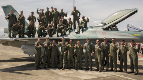 U.S. Marines with Marine All-Weather Fighter Attack Squadron (VMFA(AW)) 225 and Indonesian Air Force service members pose for a photo with an Indonesian Air Force F-16 Fighting Falcon during a closing ceremony for exercise Cope West 17 at Sam Ratulangi International Airport, Indonesia, Nov. 11, 2016. The combined training offered by this exercise helps prepare the U.S. Marine Corps and Indonesia Air Force to work together in promoting a peaceful Indo-Asia-Pacific region while practicing close air support and air-to-air training that will enhance their ability to respond to contingencies throughout the region. Both the U.S. F/A-18D Hornets and Indonesian F-16 Fighting Falcons bring unique capabilities affording the associated nations the opportunity to learn and understand each other’s skills, preparing them for real world contingencies and further strengthening their relationship. (U.S. Marine Corps photo by Cpl. Aaron Henson)