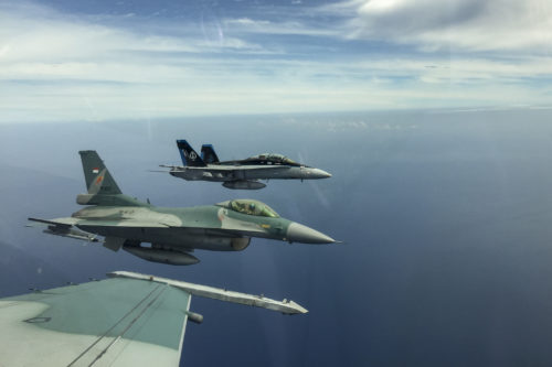 A U.S. Marine Corps F/A-18D Hornet with Marine All-Weather Fighter Attack Squadron (VMFA (AW)) 225 and two Indonesian Air Force F-16 Fighting Falcons fly in formation during exercise Cope West 17 in Indonesia, Nov. 4, 2016. This fighter-focused, bilateral exercise between the U.S. Marine Corps and Indonesian Air Force is designed to enhance the readiness of combined interoperability between the two nations. Both the U.S. F/A-18D Hornets and Indonesian F-16 Fighting Falcons bring unique capabilities affording the associated countries the opportunity to learn and understand each other’s skills, preparing them for real world contingencies and further strengthening their relationship. (Courtesy photo by TNI-AU Capt. I Gede Ngurah Satrya Wibawa)