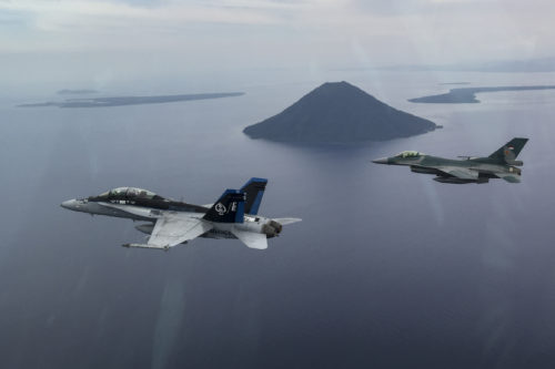A U.S. Marine Corps F/A-18D Hornet with Marine All-Weather Fighter Attack Squadron (VMFA (AW)) 225 and an Indonesian Air Force F-16 Fighting Falcon fly in formation during exercise Cope West 17 in Indonesia, Nov. 4, 2016. The combined training offered by this exercise helps prepare the U.S. Marine Corps and Indonesia Air Force to work together in promoting a peaceful Indo-Asia-Pacific region while practicing close air support and air-to-air training that will enhance their ability to respond to contingencies throughout the region. Both the U.S. F/A-18D Hornets and Indonesian F-16 Fighting Falcons bring unique capabilities affording the associated nations the opportunity to learn and understand each other’s skills, preparing them for real world contingencies and further strengthening their relationship. (Courtesy photo by TNI-AU Capt. I Gede Ngurah Satrya Wibawa)
