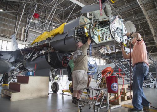 150821-F-HP195-### EDWARDS AIR FORCE BASE, Calif. (Aug. 21, 2015) Lockheed Martin technicians install hardware for mounting Scalable Agile Beam Radar (SABR) on an F-16 Fighting Falcon assigned to 416th Flight Test Squadron. Duifficulties were encountered during installation of mounting hardware, prompting technicians to make alterations to factory-supplied parts.