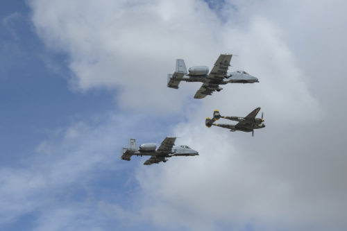 Two U.S. Air Force A-10C Thunderbolt IIs, assigned to the 354th Fighter Squadron and a part of the A-10 West Heritage Flight Team, and a P-38 Lightning fly in formation during the Los Angeles County Air Show in Lancaster, Calif., March 25, 2017. This is the team’s first air show performance after nearly five years of disbandment. (U.S. Air Force photo by Airman 1st Class Mya M. Crosby)