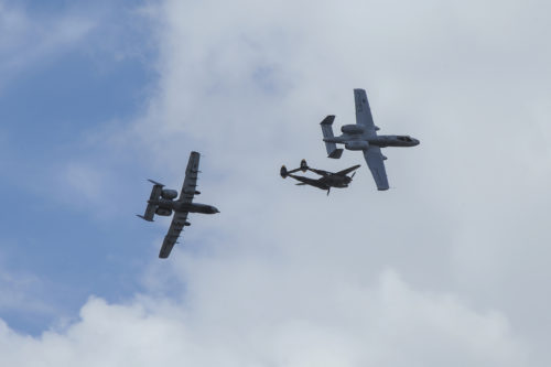 Two U.S. Air Force A-10C Thunderbolt IIs, assigned to the 354th Fighter Squadron and a part of the A-10 West Heritage Flight Team, and a P-38 Lightning break away after flying in formation during the Los Angeles County Air Show in Lancaster, Calif., March 25, 2017. This is the team’s first air show performance after nearly five years of disbandment. (U.S. Air Force photo by Airman 1st Class Mya M. Crosby)
