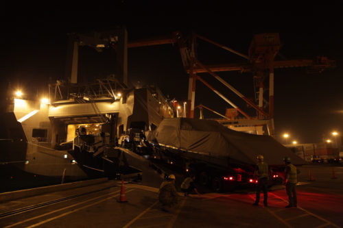 U.S. Soldiers and contractors direct the off-loading of a boat from USNS Fisher (T-AKR 301) during port operations for Balikatan 2017 at Subic Bay, Zambales, April 30, 2017. Balikatan is an annual U.S.-Philippine bilateral military exercise focused on a variety of missions, including humanitarian assistance and disaster relief, counterterrorism and other combined military operations. (U.S. Army photo by Spc. Mitchell Knaus)