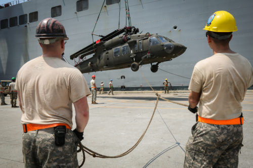 U.S. Soldiers guide a UH-60 Black Hawk off USNS Fisher (T-AKR 301) during port operations in support of Balikatan 2017 at Subic Bay, Zambales, May 1, 2017. Balikatan is an annual U.S.-Philippine bilateral military exercise focused on a variety of missions, including humanitarian assistance and disaster relief, counterterrorism, and other combined military operations. (U.S. Army photo by Staff Sgt. Nashaunda Tilghman)