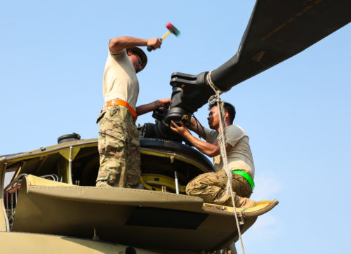 U.S. Army Sgt. Johned Cabuco and Spc. Abraham Romero attach a rotor to a CH-47 Chinook helicopter during port operations in support of Balikatan 2017 at Subic Bay, Zambales, May 1, 2017. Cabuco and Romero are with the 25th Combat Aviation Brigade, 25th Infantry Division. Balikatan is an annual U.S.-Philippine bilateral military exercise focused on a variety of missions, including humanitarian assistance and disaster relief, counterterrorism, and other combined military operations. (U.S. Army photo by Staff Sgt. Nashaunda Tilghman)