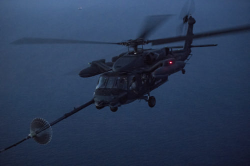 A Japan Air Self-Defense Force UH-60J Black Hawk assigned to the Hamamatsu Air Rescue Squadron executes helicopter air-to-air refueling over the Pacific Ocean, June 15, 2017, during Exercise Teak Jet. This is the first time that members of the 353rd Special Operations Group held HAAR training at night with JASDF members in Honshu Island in Japan. (U.S. Air Force photo by Yasuo Osakabe)