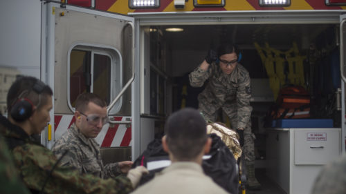 Personnel from the 35th Medical Group and 35th Operations Group work with Akita Prefecture Rescue Squadron pararescuemen and aircrew to lift a simulated injured pilot during exercise Cope Angel 17 at Misawa Air Base, Japan, Aug. 9, 2017. This exercise showcased the interoperability abilities between the U.S. and Japan during rescue and triage operations. This was the first time this type of exercise occured on mainland Japan. (U.S. Air Force photo by Staff Sgt. Deana Heitzman)