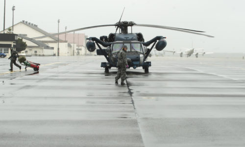 Members of the Japan Air Self-Defense Force rescue team from Akita Air Base, Japan, prepare a UH-60J Black Hawk for take-off at Misawa Air Base, Japan, during Cope Angel 17, Aug. 9, 2017. Cope Angel is a bilateral search and rescue exercise between the U.S. Air Force and Japan service members. This was the first time an exercise of this nature occured on mainland Japan. (U.S. Air Force photo by Staff Sgt. Melanie A. Hutto)