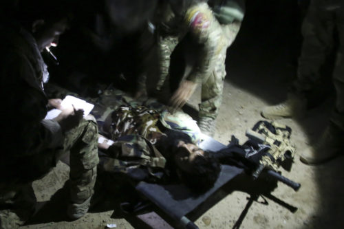 Afghan National Army soldiers with 7th Special Operations Kandak, 215th Corps provide medical care to a notionally wounded soldier during night casualty evacuation training at Camp Shorabak, Afghanistan, Sept. 10, 2017. Approximately 65 soldiers with the unit rehearsed and refined their CASEVAC process in the dark, which simulated realistic training in preparation for potential real-world operations. (U.S. Marine Corps photo by Sgt. Lucas Hopkins)