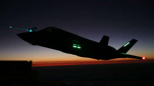 An F-35B Lightning II aircraft with Marine Fighter Attack Squadron (VMFA) 121 based out of Marine Corps Air Station (MCAS) Iwakuni, Japan, conducts a nighttime aerial refueling training operation with a KC-130J Hercules with Marine Aerial Refueler Transport Squadron (VMGR) 152 based out of MCAS Iwakuni Oct. 25, 2017. The training was conducted at night to improve operational readiness and enhance pilot proficiency. (U.S. Marine Corps photo by Lance Cpl. Mason Roy)