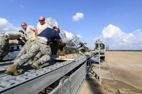 Airmen assigned to the 2nd Logistics Readiness Squadron air transportation flight load a conventional rotary launcher onto a Halverson K-loader at Barksdale Air Force Base, La., Nov. 3, 2017. The CRL was later loaded onto a C-5M Supergalaxy for deployment. (U.S. Air Force Photo by Airman 1st Class Sydney Campbell)