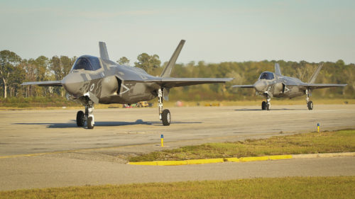 Two pilots taxi down the flightline in F-35B Lightning II Joint Strike Fighters aboard Marine Corps Air Station Beaufort, Nov. 6. The Airborne Tactical Advantage Company is training with Marine Fighter Attack Training Squadron 501 for the next two weeks to support new and transition pilots in their certification for the F-35B. The pilots are with VMFAT-501, Marine Aircraft Group 31.