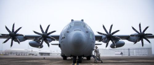 A 153rd Airlift Wing maintainer plugs in a generator cable into her C-130H after arriving at Eglin Air Force Base, Fla., Jan. 11. Air Force’s first fully upgraded C-130H is here for test and evaluation on its new modified propeller system and engines. (U.S. Air Force photo/Samuel King Jr.)