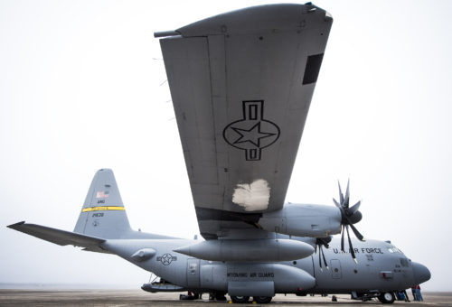 A chunk of ice hangs from the bottom of the C-130H’s wing after its flight from Wyoming to Eglin Air Force Base, Fla., Jan. 11. Air Force’s first fully upgraded C-130H is here for test and evaluation on its new modified propeller system and engines. (U.S. Air Force photo/Samuel King Jr.)