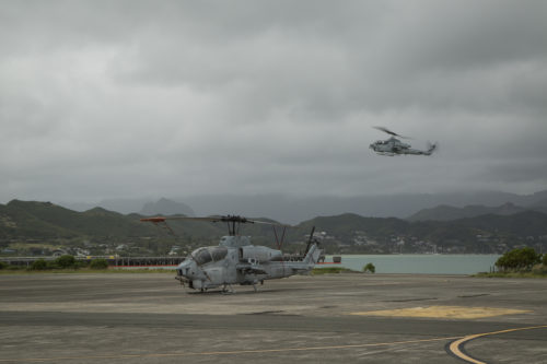 Two AH-1W Super Cobra helicopters prepare for landing on Marine Corps Base Hawaii, March 13, 2018. As a part of the transition to flying the AH-1Z Viper helicopters, Marine Light Attack Squadron took their last flight with AH-1Ws before their retirement. (U.S. Marine Corps photo by Sgt. Kathy Nunez)