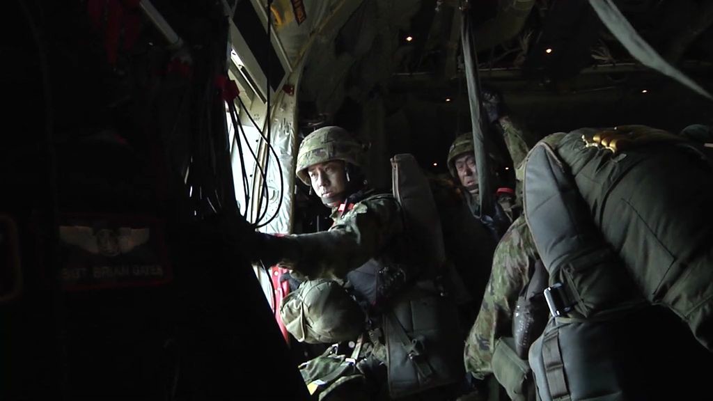 Watch JGSDF paratroopers jump out of a USAF C-130J